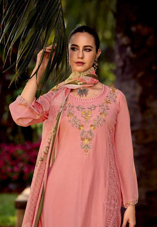 A soft pastel suit adorned with delicate thread embroidery, complemented by a digitally printed floral chiffon dupatta, offering a graceful and feminine ensemble perfect for any occasion.
